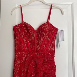 Prom dress never worn! Size 2 but fits bigger. I’m 5’5 & it touches the floor.